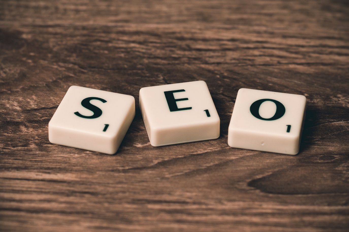 A photo of letter blocks placed together making word "SEO"